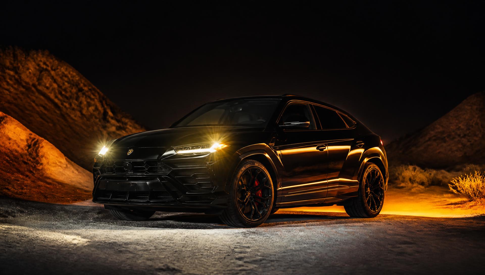 Luxury SUV with custom Desert Eagle headlights in Dubai desert at twilight